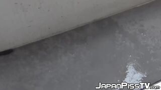 Gorgeous Oriental minx spilling urine on staircase